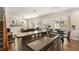 Sunlit kitchen boasts granite counters, stainless appliances, and breakfast nook overlooking the pool at 7606 S Sparkman St, Tampa, FL 33616