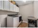 Laundry room with upper cabinets and ample storage space at 7606 S Sparkman St, Tampa, FL 33616