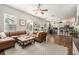 Spacious living room with modern decor, a large leather sofa, and lots of natural light at 7606 S Sparkman St, Tampa, FL 33616