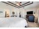 Generously sized main bedroom featuring a tray ceiling and sitting area at 7606 S Sparkman St, Tampa, FL 33616