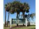 Picnic Island Park sign with list of amenities: playground, boat ramp, fishing pier, beach at 7606 S Sparkman St, Tampa, FL 33616