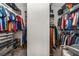 Spacious walk-in closet featuring ample shelving, hanging space, and organized storage solutions at 7606 S Sparkman St, Tampa, FL 33616