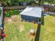 Aerial view featuring a fenced backyard with play area and a well-maintained lawn at 901 King St, Plant City, FL 33563