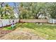 Spacious backyard with fenced yard, green lawn, and space for children to play, perfect for outdoor recreation at 901 King St, Plant City, FL 33563