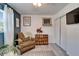 Tastefully decorated bedroom with closet, wall art, wood-look flooring, and natural light at 901 King St, Plant City, FL 33563