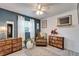 Cozy bedroom with modern accents, warm lighting, and a full length mirror at 901 King St, Plant City, FL 33563
