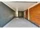 A look at the covered carport area with access to the front entry door and wooden accent wall at 901 King St, Plant City, FL 33563