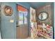 Bright entryway with a gray front door and playful toy storage, illuminated by natural light at 901 King St, Plant City, FL 33563