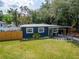 Charming home with a cozy front porch swing and well manicured garden from above at 901 King St, Plant City, FL 33563