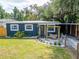 Charming home exterior with a cozy front porch swing and well manicured garden at 901 King St, Plant City, FL 33563