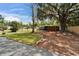 Exterior view of the home's curb appeal and surroundings showcases the driveway and landscaping at 901 King St, Plant City, FL 33563