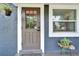 Close up of a modern front door, updated door hardware, and stylish exterior finishes at 901 King St, Plant City, FL 33563