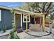 Charming front entrance featuring a swing, updated landscaping, and a welcoming front door at 901 King St, Plant City, FL 33563