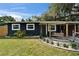 Inviting front porch with a swing, landscaping, and a walkway leading to the main entrance at 901 King St, Plant City, FL 33563