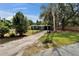 Charming home with a well-manicured front yard and an inviting walkway leading to the entrance at 901 King St, Plant City, FL 33563