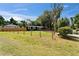 Inviting home exterior featuring a spacious front lawn, driveway, and partial fencing at 901 King St, Plant City, FL 33563