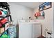 Laundry room featuring washer, dryer, and water heater at 901 King St, Plant City, FL 33563