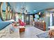 Spacious living room featuring eclectic decor, an open layout, and seamless transitions to the kitchen and entryway at 901 King St, Plant City, FL 33563