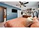 Spacious main bedroom with eclectic decor and a ceiling fan at 901 King St, Plant City, FL 33563