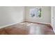 Bedroom with wood floors and ample natural light coming through the window at 933 E Shadowlawn Ave, Tampa, FL 33603
