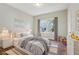 Cozy bedroom with hardwood flooring, soft lighting, and playful decor at 933 E Shadowlawn Ave, Tampa, FL 33603