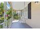 This is an inviting front porch with a swing offering a relaxing view of the surroundings at 933 E Shadowlawn Ave, Tampa, FL 33603