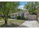 Charming home exterior with manicured lawn and lush landscaping creating a welcoming curb appeal at 933 E Shadowlawn Ave, Tampa, FL 33603