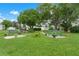Serene green space featuring benches and landscaping, creating a peaceful environment at 10008 Daffodil N St # 186, Pinellas Park, FL 33782