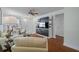 Open living space showcasing hardwood floors, modern entertainment center, and comfortable seating at 10008 Daffodil N St # 186, Pinellas Park, FL 33782