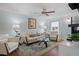 Cozy living room with stylish furnishings, a ceiling fan, and plenty of natural light at 10008 Daffodil N St # 186, Pinellas Park, FL 33782