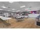 Large meeting room with tables and chairs set up on a hardwood floor, decorated with patriotic themes at 10008 Daffodil N St # 186, Pinellas Park, FL 33782