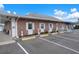 Exterior view of the office building with well-maintained landscaping, designated parking, and clear signage at 10008 Daffodil N St # 186, Pinellas Park, FL 33782