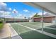 Shuffleboard courts and covered seating area, providing residents a communal space for games and relaxation at 10008 Daffodil N St # 186, Pinellas Park, FL 33782