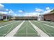 Outdoor shuffleboard courts with covered seating, offering a recreational space for residents in the community at 10008 Daffodil N St # 186, Pinellas Park, FL 33782