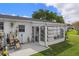 Cozy sunroom features many windows to enjoy the views of Florida, bringing natural light and outdoor living indoors at 10008 Daffodil N St # 186, Pinellas Park, FL 33782