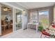 Enclosed sunroom features tiled floors and sliding glass doors leading to the dining room at 10008 Daffodil N St # 186, Pinellas Park, FL 33782