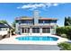 Rear exterior view showcasing the pool, screened in patio, and home's backyard at 10404 Crestfield Dr, Riverview, FL 33569