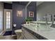 Stylish bathroom with a modern glass vessel sink and unique decor at 10404 Crestfield Dr, Riverview, FL 33569