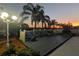 Backyard deck at sunset features lounge chairs and beautiful landscaping at 10404 Crestfield Dr, Riverview, FL 33569