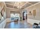 Formal dining room showcasing coffered ceiling, wainscoting, and a view of the front yard at 10404 Crestfield Dr, Riverview, FL 33569