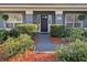 Charming home featuring a manicured front yard with mature landscaping at 10404 Crestfield Dr, Riverview, FL 33569