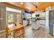 Charming eat-in kitchen with island, stainless steel appliances, and access to backyard at 10404 Crestfield Dr, Riverview, FL 33569