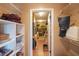 Walk-in closet offers ample storage space with shelving and hanging areas at 10404 Crestfield Dr, Riverview, FL 33569