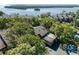 A high-angle view of a home with dense trees and foliage at 1111 N Bayshore Blvd # E3, Clearwater, FL 33759