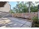 A backyard with paver patio and rock wall providing privacy from neighbors at 1111 N Bayshore Blvd # E3, Clearwater, FL 33759