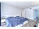 Bright bedroom features two twin beds, hardwood floors, and is bathed in natural light at 1111 N Bayshore Blvd # E3, Clearwater, FL 33759