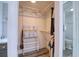 Open closet reveals adjustable shelving and rack, conveniently situated adjacent to bathroom at 1111 N Bayshore Blvd # E3, Clearwater, FL 33759