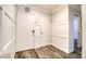 Bright entryway featuring modern wood-look floors and decorative wainscoting at 1111 N Bayshore Blvd # E3, Clearwater, FL 33759