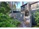 Exterior view of the back of the house, patio, and landscaping at 1111 N Bayshore Blvd # E3, Clearwater, FL 33759