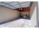 Spacious garage featuring an automatic door, ample storage space, and a clean concrete floor at 1111 N Bayshore Blvd # E3, Clearwater, FL 33759
